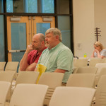 Recs Division Manager Hugh Leslie and Community Development Director Eric Phillips listen to debate on recreation projects