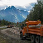 Dump truck hauling rock armour