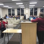 Mat-Su Health Foundation's Elizabeth Ripley gives the thumbs up as Assembly Member Barbara Doty talks of a coming alpine (downhill) ski area.