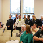 EMS responders stand to be recognized by the Assembly, Mayor, and audience